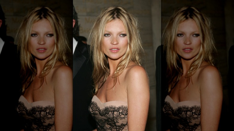 Kate Moss with messy blonde hair and bold black eyeliner