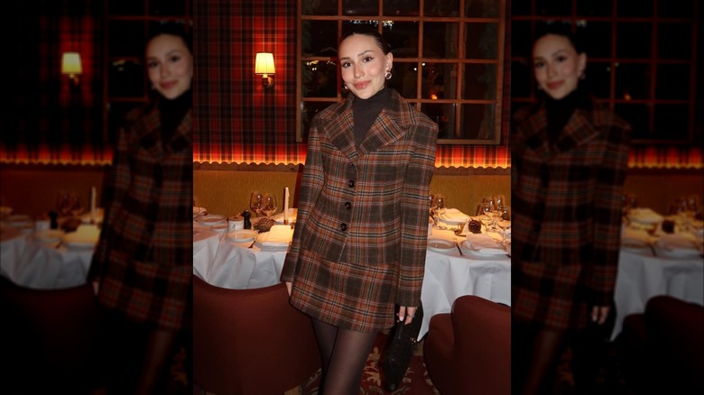 A woman on Instagram in a plaid skirt suit