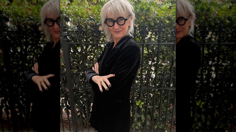 A woman in a black velvet blazer