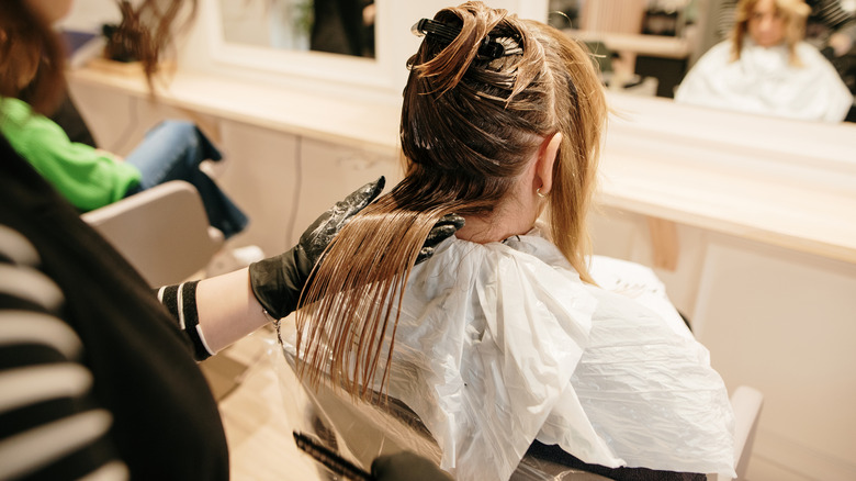 Woman getting her hair done at a salon