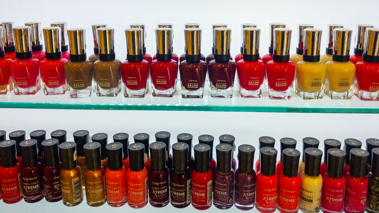 Store shelves with lines of Sally Hansen nail polish