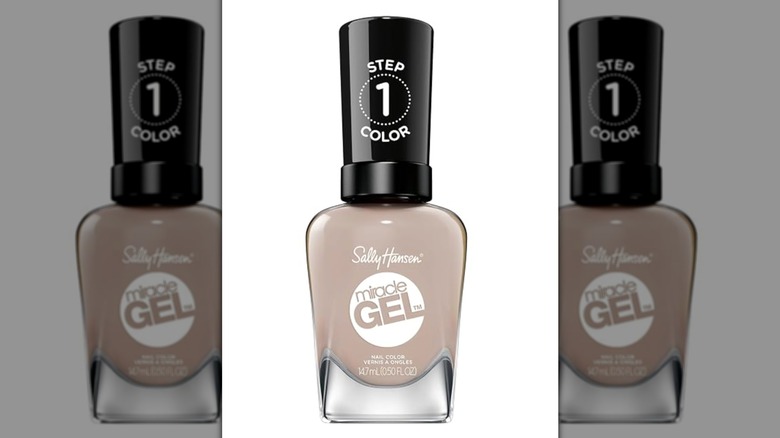 A bottle of Sally Hansen nail polish in a milky brown shade