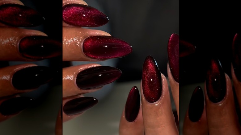 A woman with a velvet merlot manicure on long nails