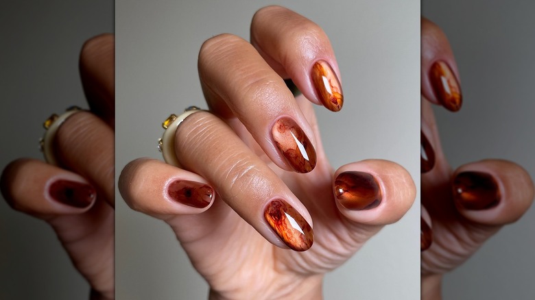 Nail artist showing off her manicure.