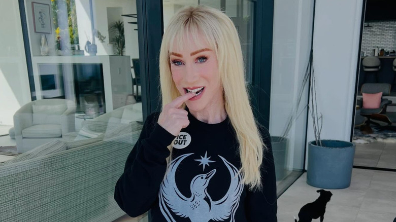 Kathy Griffin bites her finger with blond hair