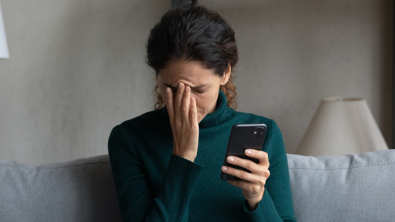 Woman reacting to phone