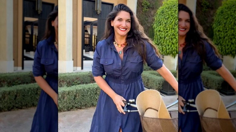 A photo of fashion influencer Emily Jane Johnston in a navy button-down dress