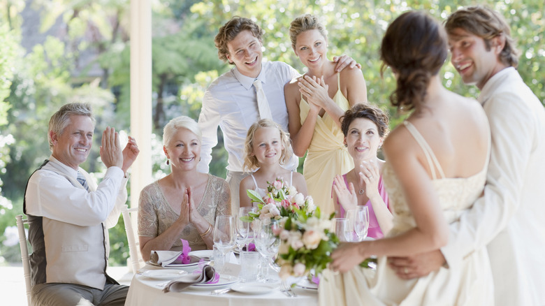 A family at a table on a wedding day
