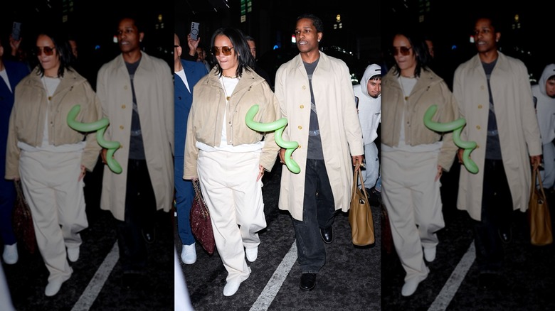 Rihanna wearing a beige coat and A$AP Rocky wearing a beige trench coat