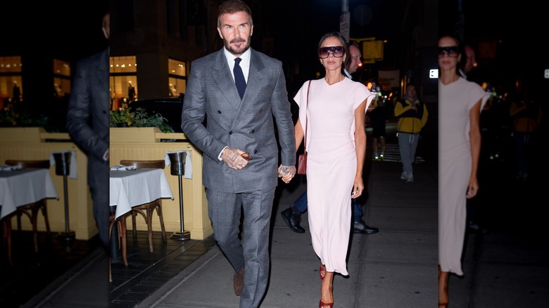 Victoria Beckham and David Beckham walk wearing a pink dress and a plaid suit