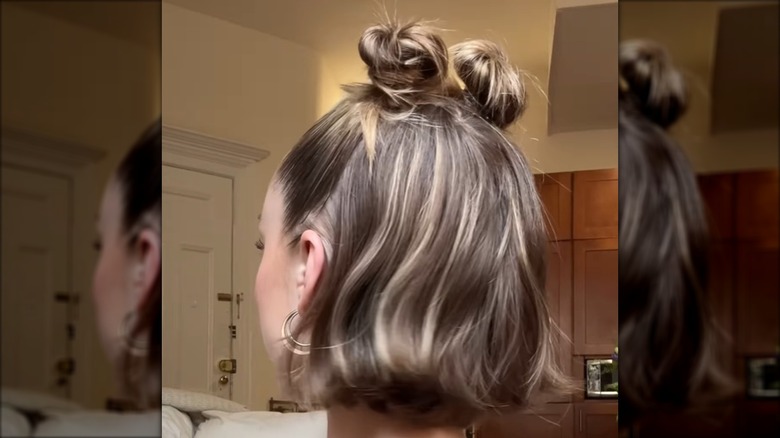 A woman with space buns and a bob
