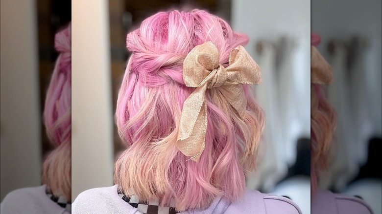 A woman with a a ribbon tied in her hair