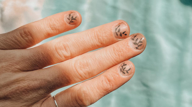 Botanical fingernail tattoos