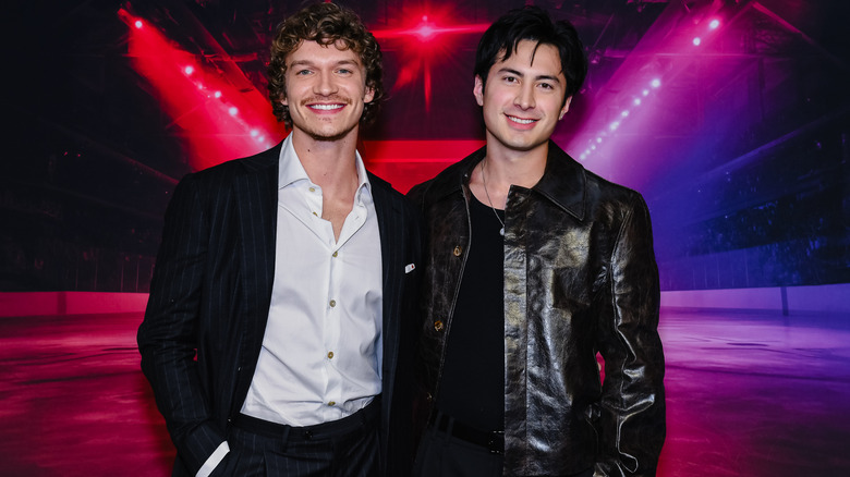 Connor Storrie and Hudson Williams wearing black jackets