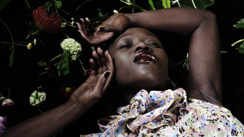Lying in flowers
