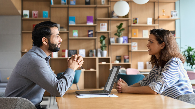 Woman meeting with boss