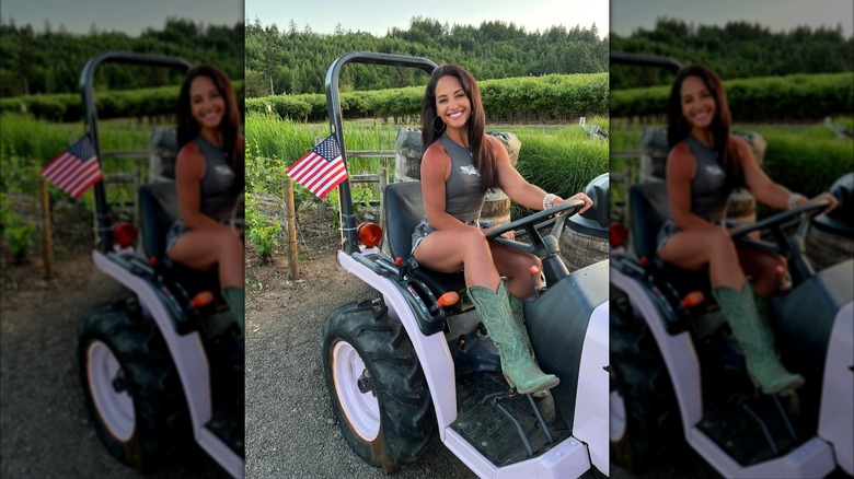 Emily Compagno on a golf cart at a winery