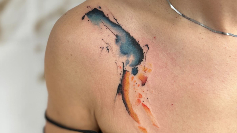 Watercolor collarbone tattoo