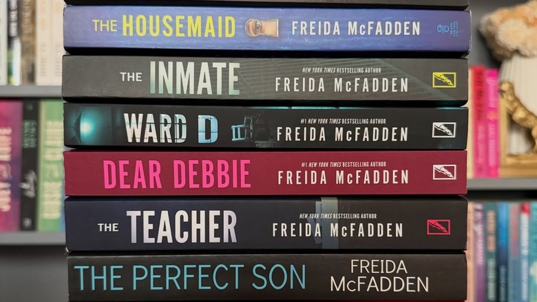 A stack of books by Freida McFadden