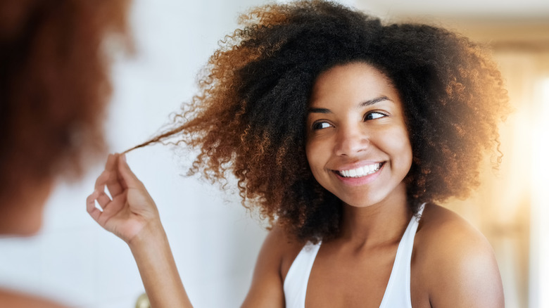 woman admiring hair