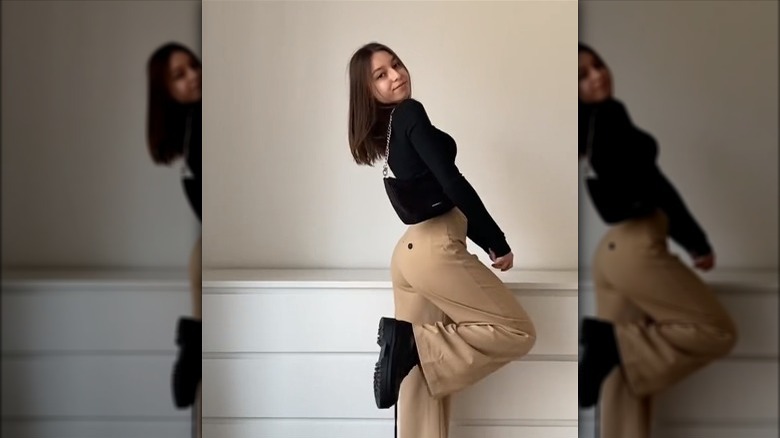 Beige pants, black crop top