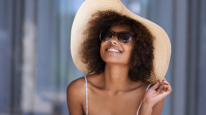 A woman wearing a sun hat