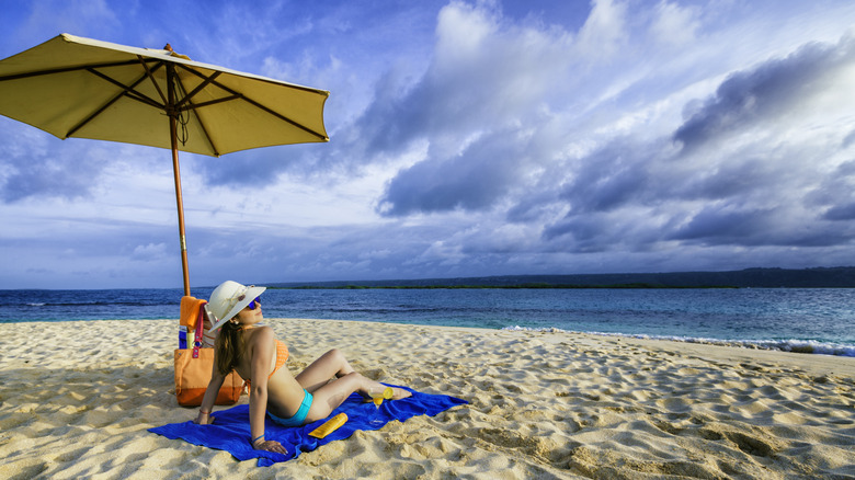 A woman sitting on the beach
