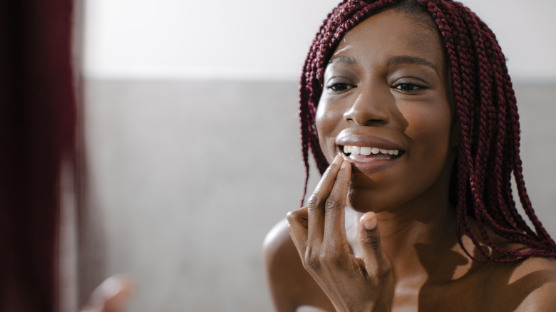 Applying lip balm