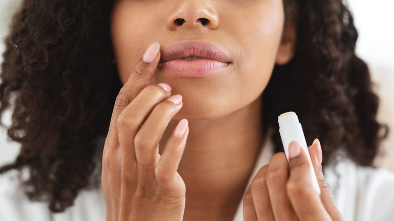 Person applying lipbalm