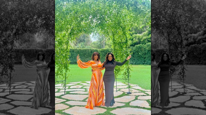 Gayle King smiles with Oprah Winfrey in 2024