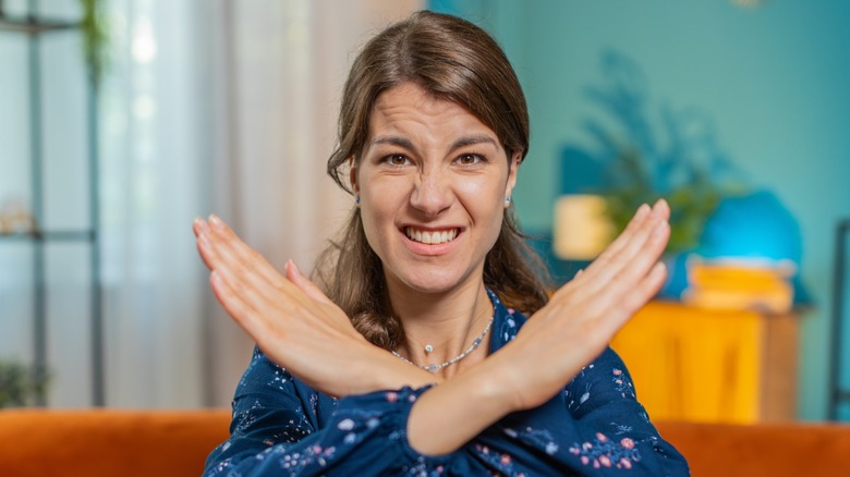 A woman with her arms crossed in front of her