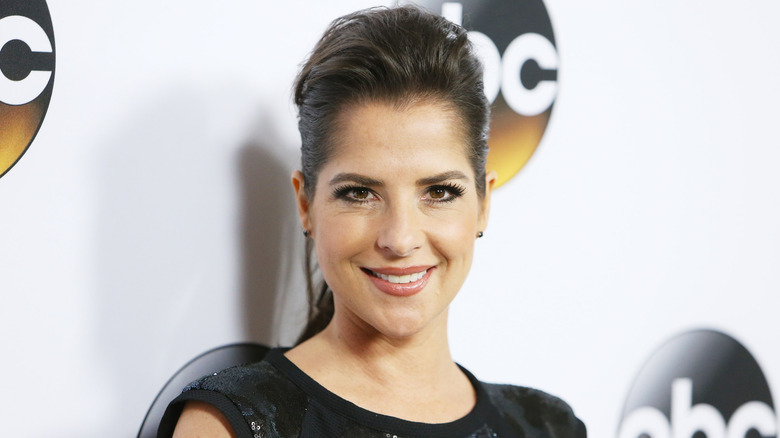Kelly Monaco smiles on the red carpet in 2015