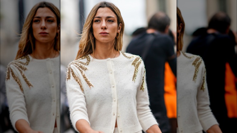 A woman in a glitter sweater 