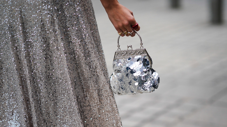 A silver sequin skirt and bag 
