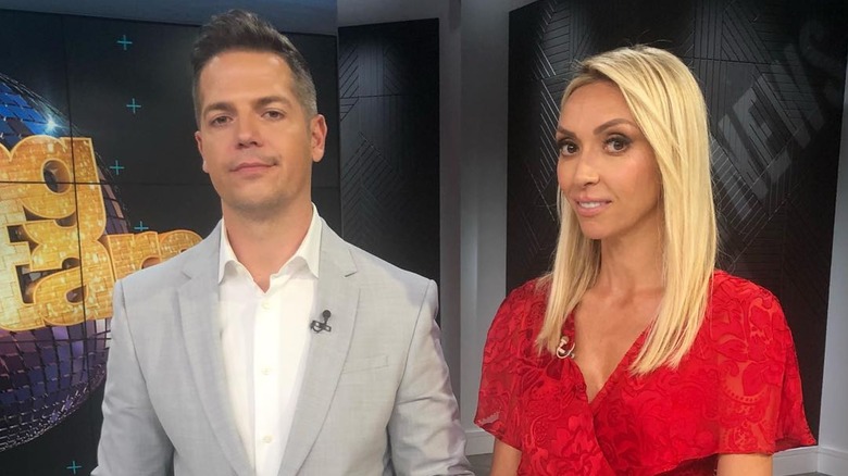 Jason Kennedy and Giuliana Rancic on the set of E! News