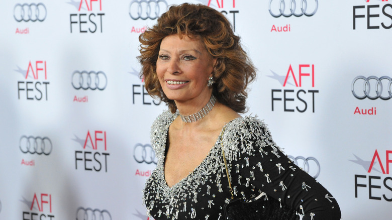 Sophia Loren in a diamond choker and a black sparkly dress at an event in 2014