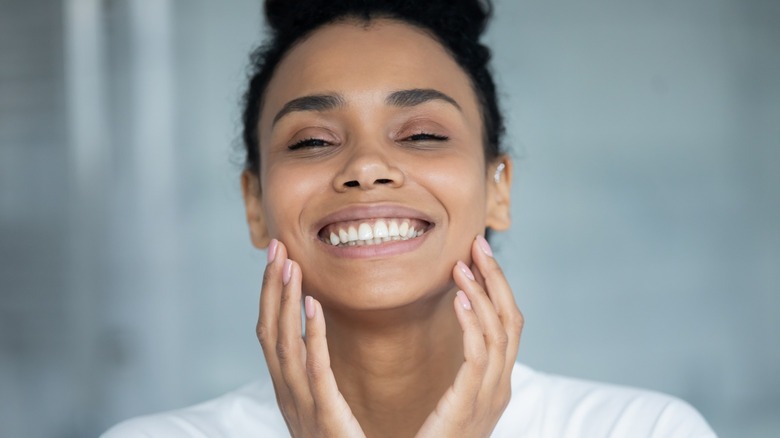 Woman smiling with glowing skin