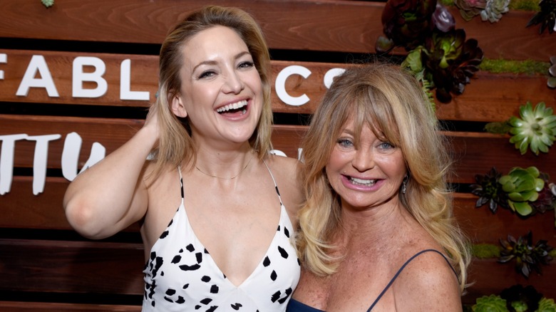 Goldie Hawn posing with Kate Hudson in 2016