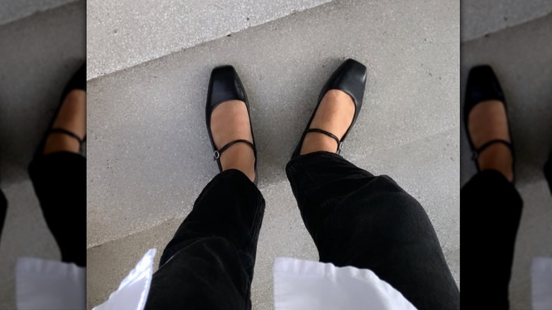A pair of Mary Jane black flat one concrete steps
