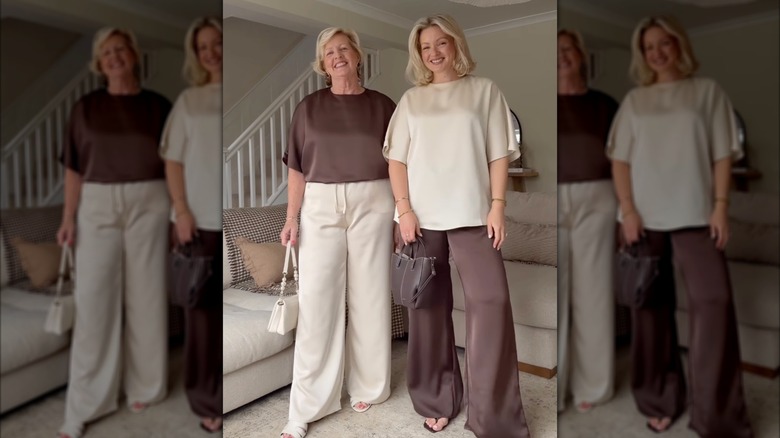 A mother and daughter wear cream and brown satin trousers