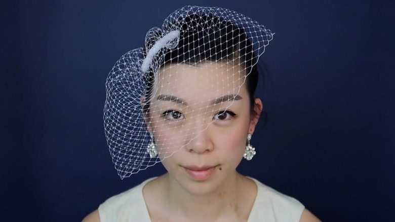A woman on YouTube creating tutorials for unique bridal headpieces