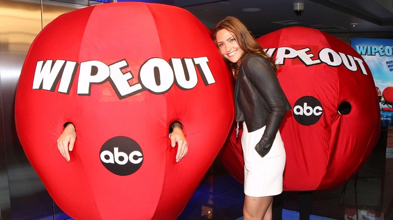 Jill Wagner posing with people dressed as the inflatable red balls from "Wipeout" in 2009