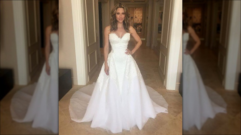 Jill Wagner posing in a white, strapless wedding dress