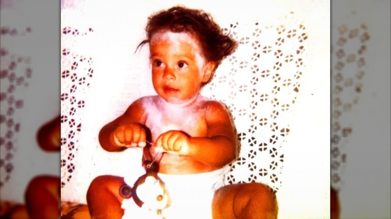 Oona Chaplin as a baby wearing a diaper