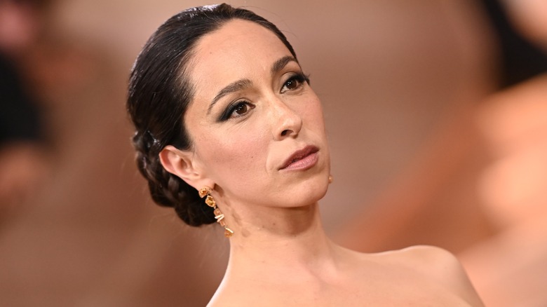 Oona Chaplin with a neutral expression on the Golden Globes red carpet in 2026