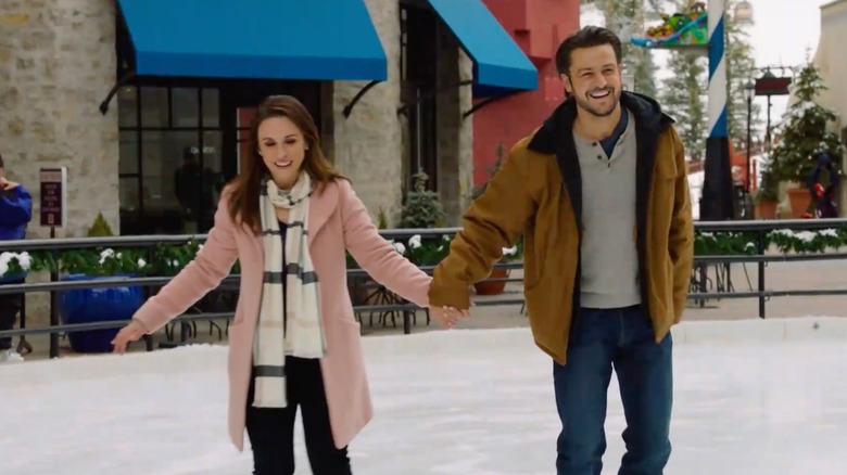 Tyler Hynes in "Winter in Vail" holding hands with Lacey Chabert while skating