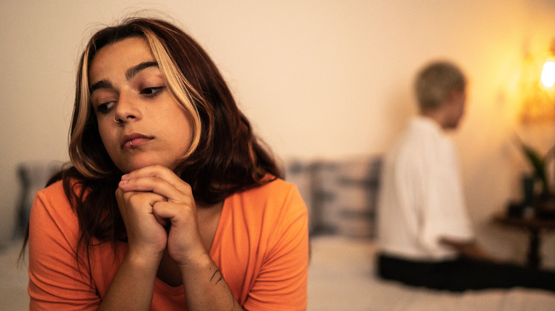 couple arguing in bed