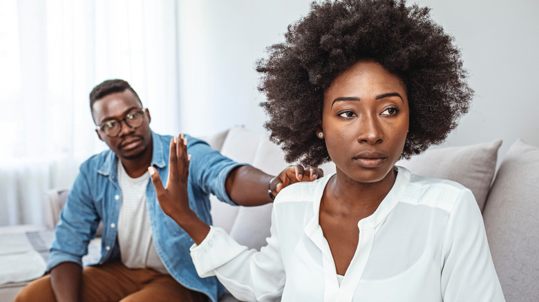 couple arguing on couch