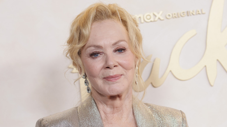 Jean Smart smiles wearing a silver blazer