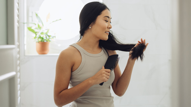 Woman brushing hair